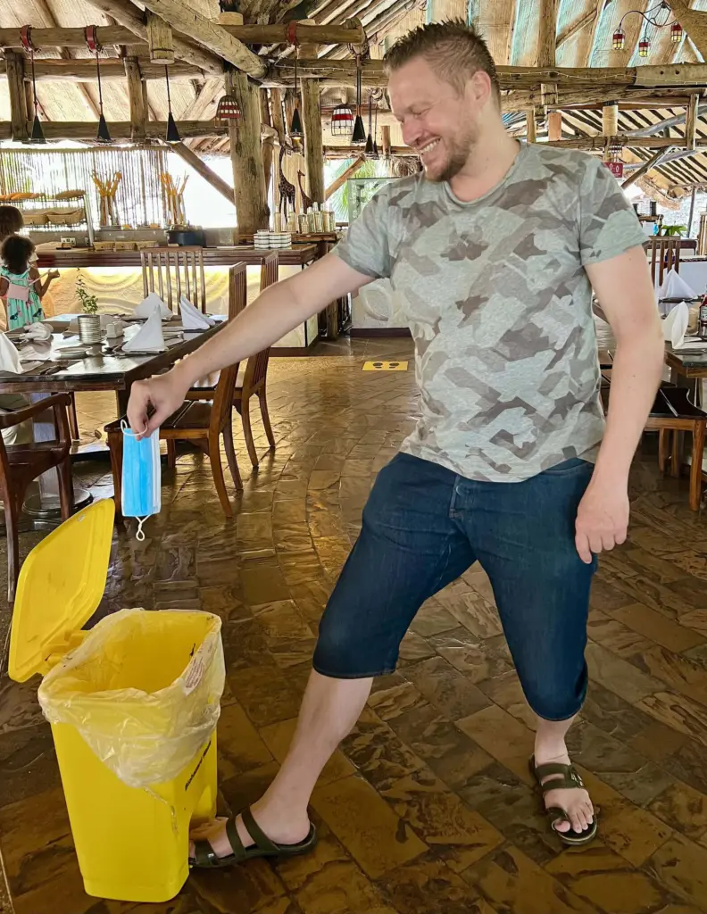 End of Covid: Me throwing my mask in the dustbin